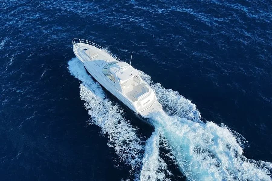 Aerial view of a private motor yacht cruising on a Punta Cana yacht rental