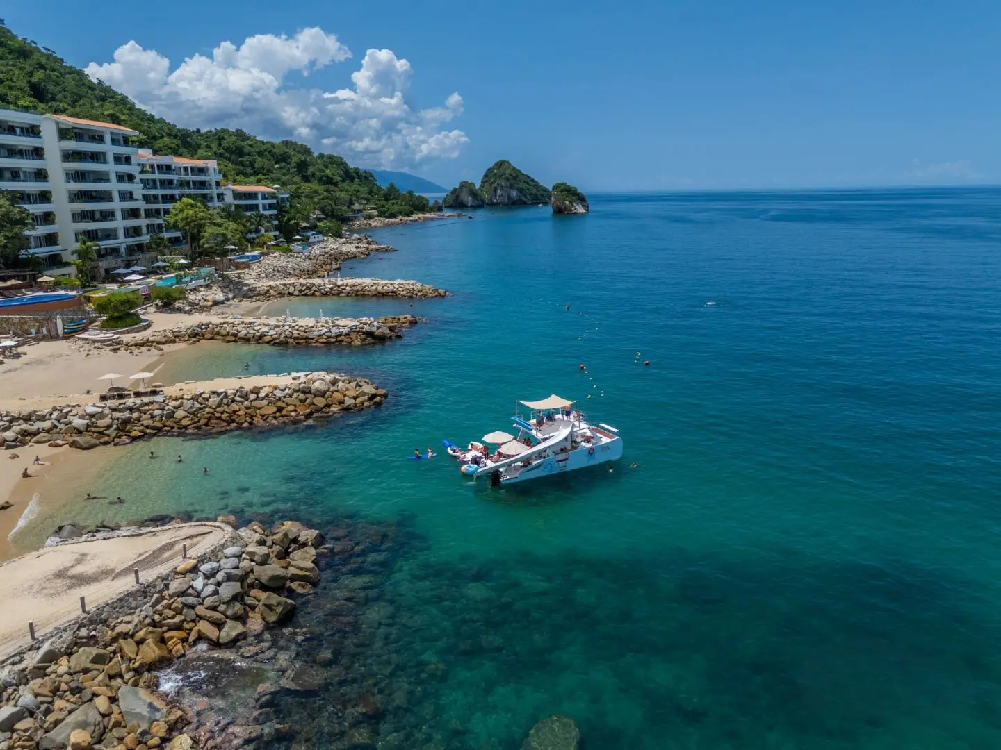 Private boat anchored off a hotel beach in Puerto Vallarta