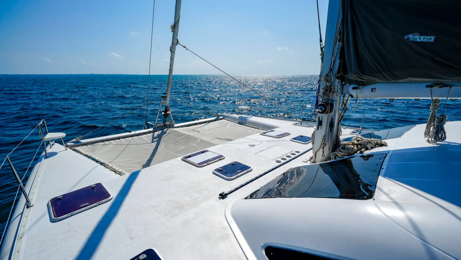 Foredeck nets and mast of a sailing catamaran on an Isla Mujeres trip from Cancún