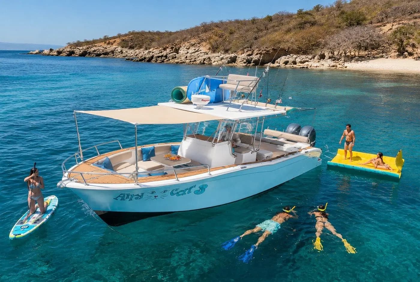 Aerial view of snorkelers, a paddleboarder and a floating mat around a center-console boat off Puerto Vallarta