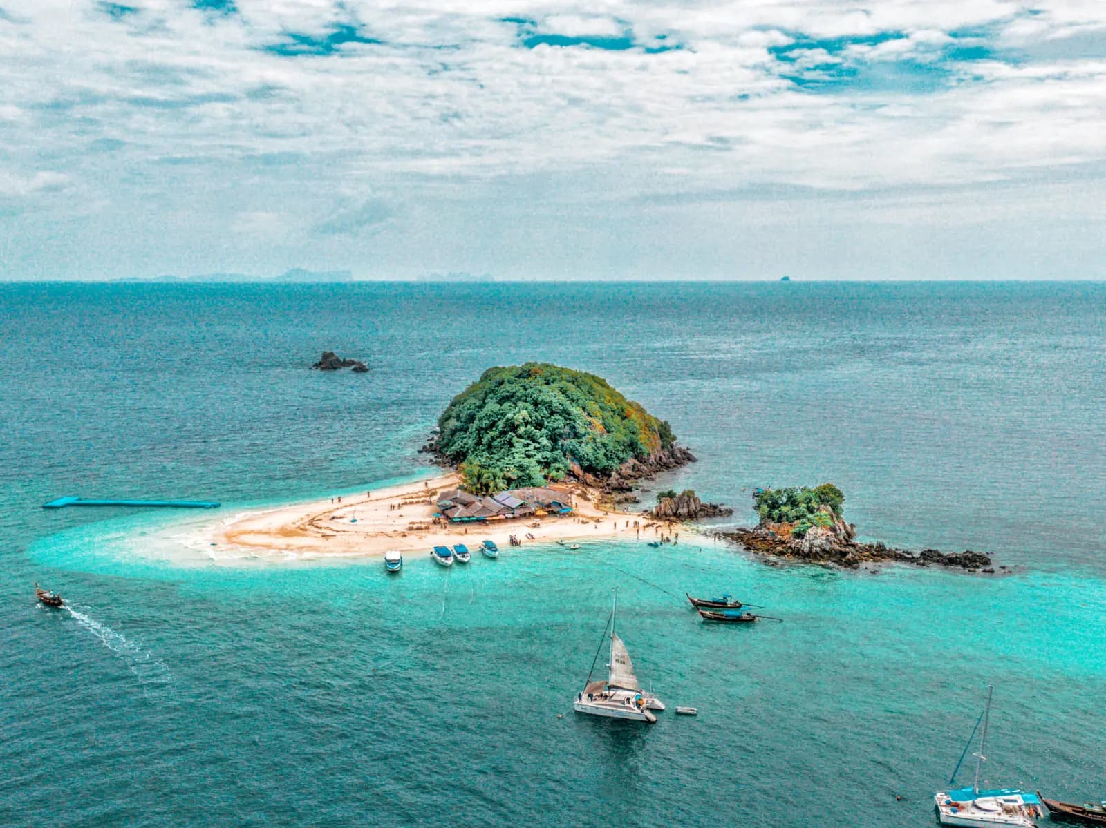 Aerial view of a sandbar island with longtail boats near Phuket, Thailand