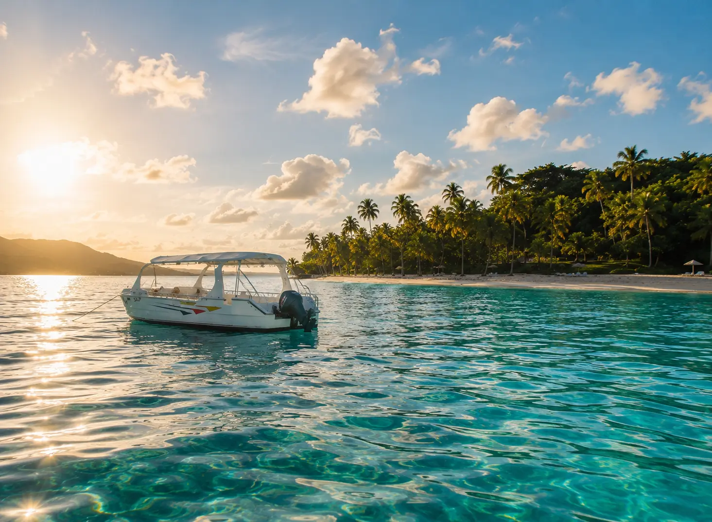 Motor catamaran anchored in glowing turquoise water off Cayo Levantado under a low golden sun