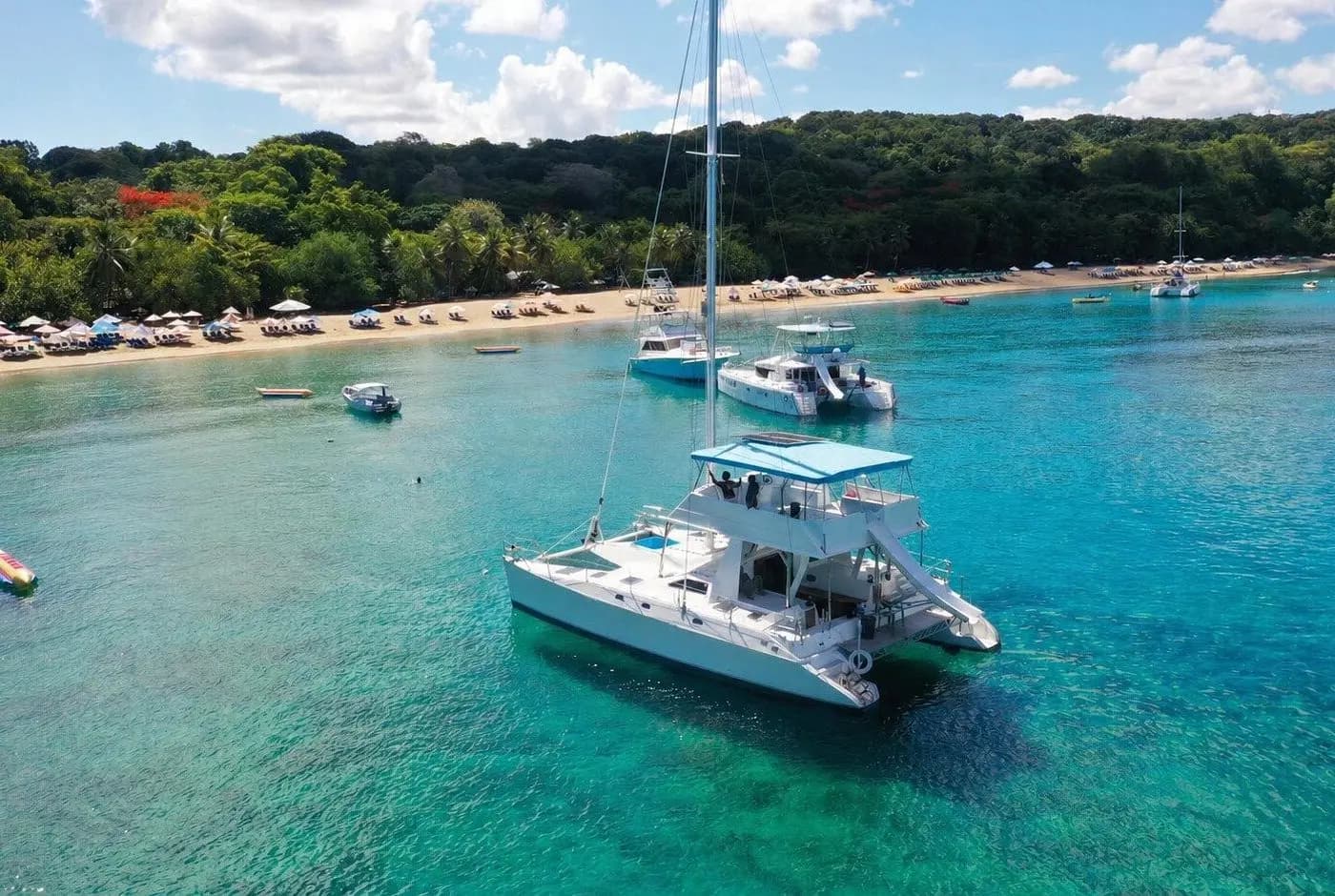 VIP Beach Boarding at Sosúa Beach (~45 min)  Meet captain & hostess, short tender boat transfer (2-5 min) to the catamaran anchored in the bay