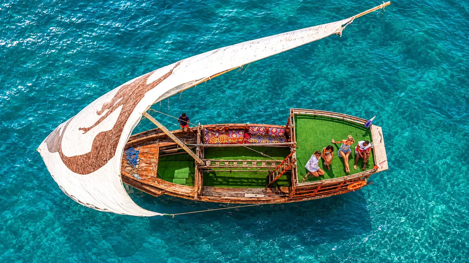 Cruise Toward Mnemba Reef Scenic coastal sail with a chance to spot wild dolphins along the way