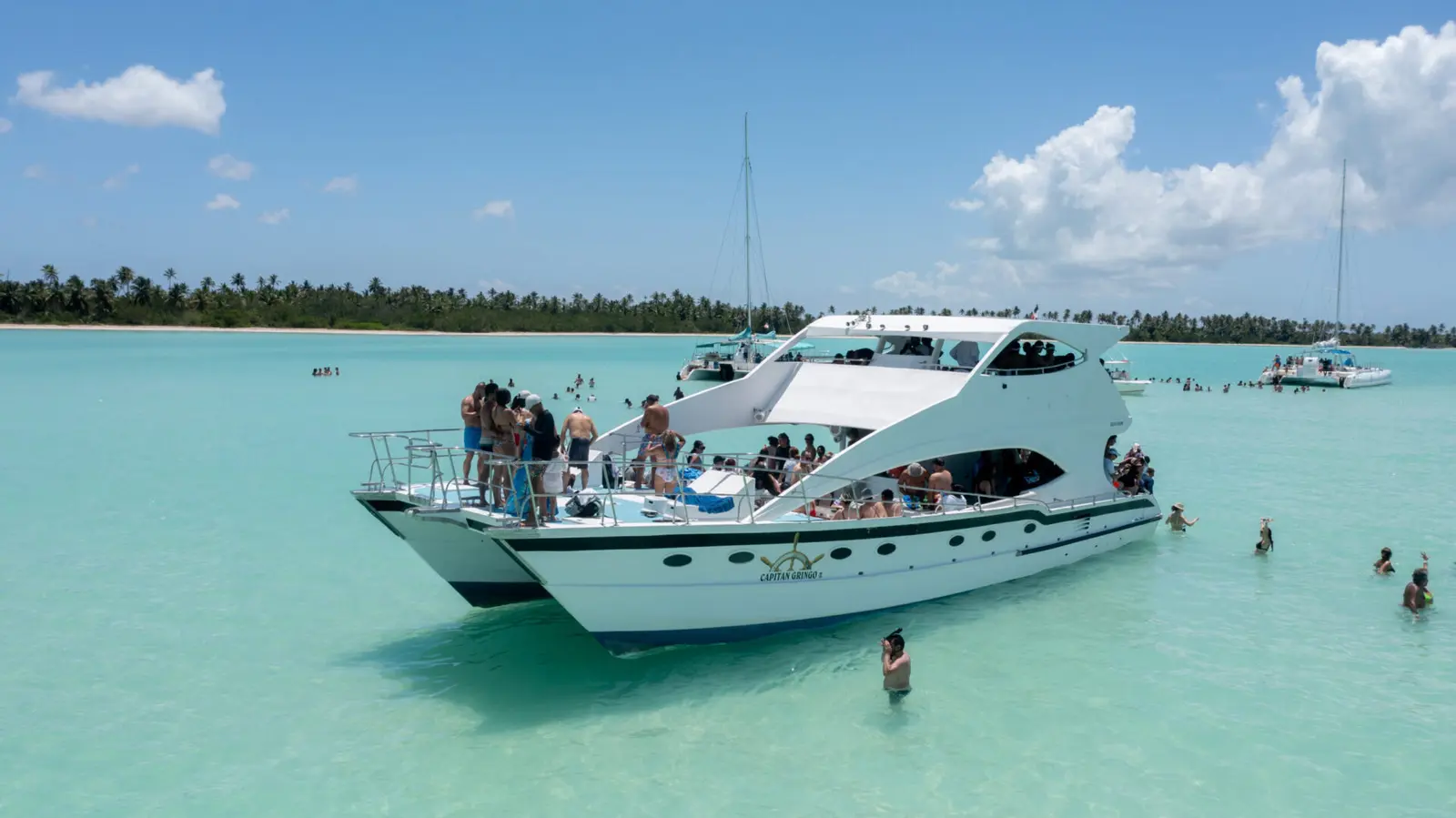 Boarding & cruise Catamaran ride with drinks, music, and ocean views
