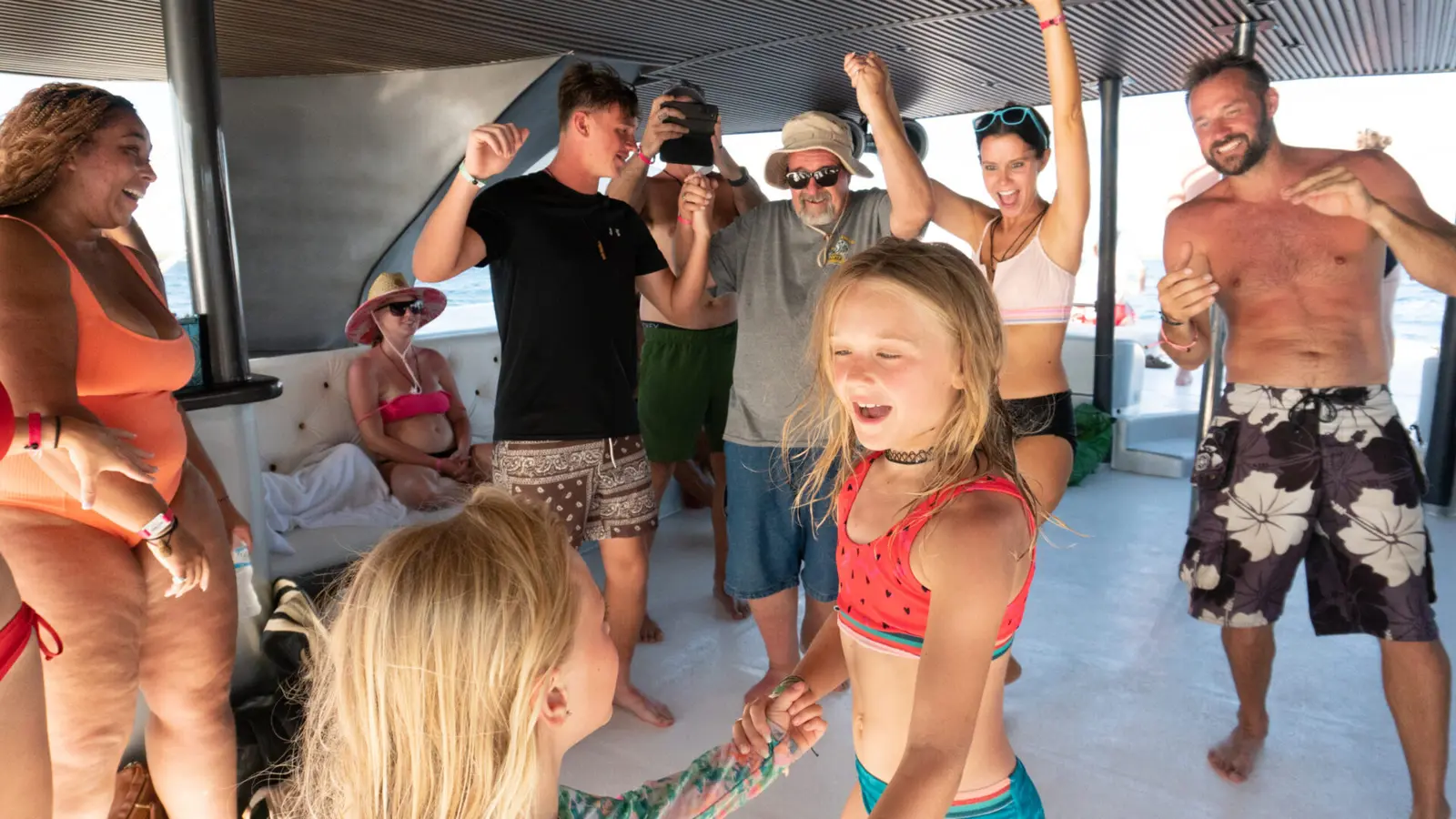 Group Cruising — The wide deck means no one feels crowded. Music on, drinks flowing, the Caribbean opening up  ahead. This is when everyone realises the day is going to be exactly as good as they hoped.