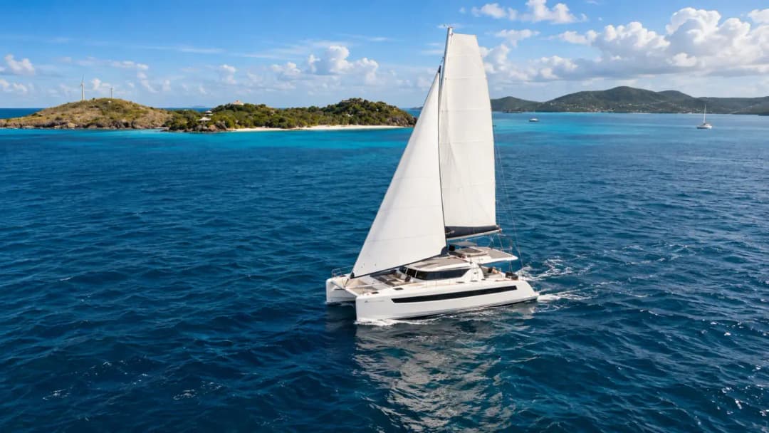 Luxury catamaran sailing through the turquoise waters of Cozumel on a private excursion.