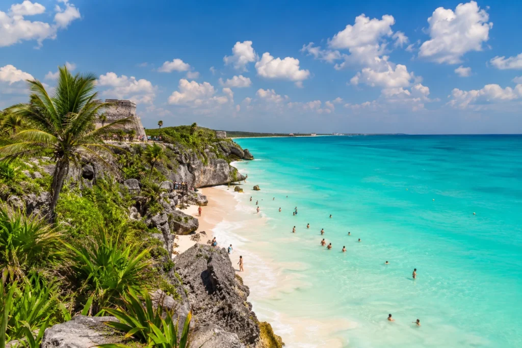 Cancun weather April collage showing sunny beaches, snorkeling in clear turquoise water, catamaran sailing, Mayan ruins, cenotes, and colorful local culture in Cancun.