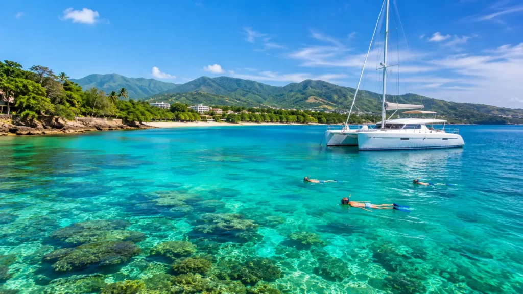 Private catamaran with snorkelers in clear calm water at Sosúa Bay, Puerto Plata.