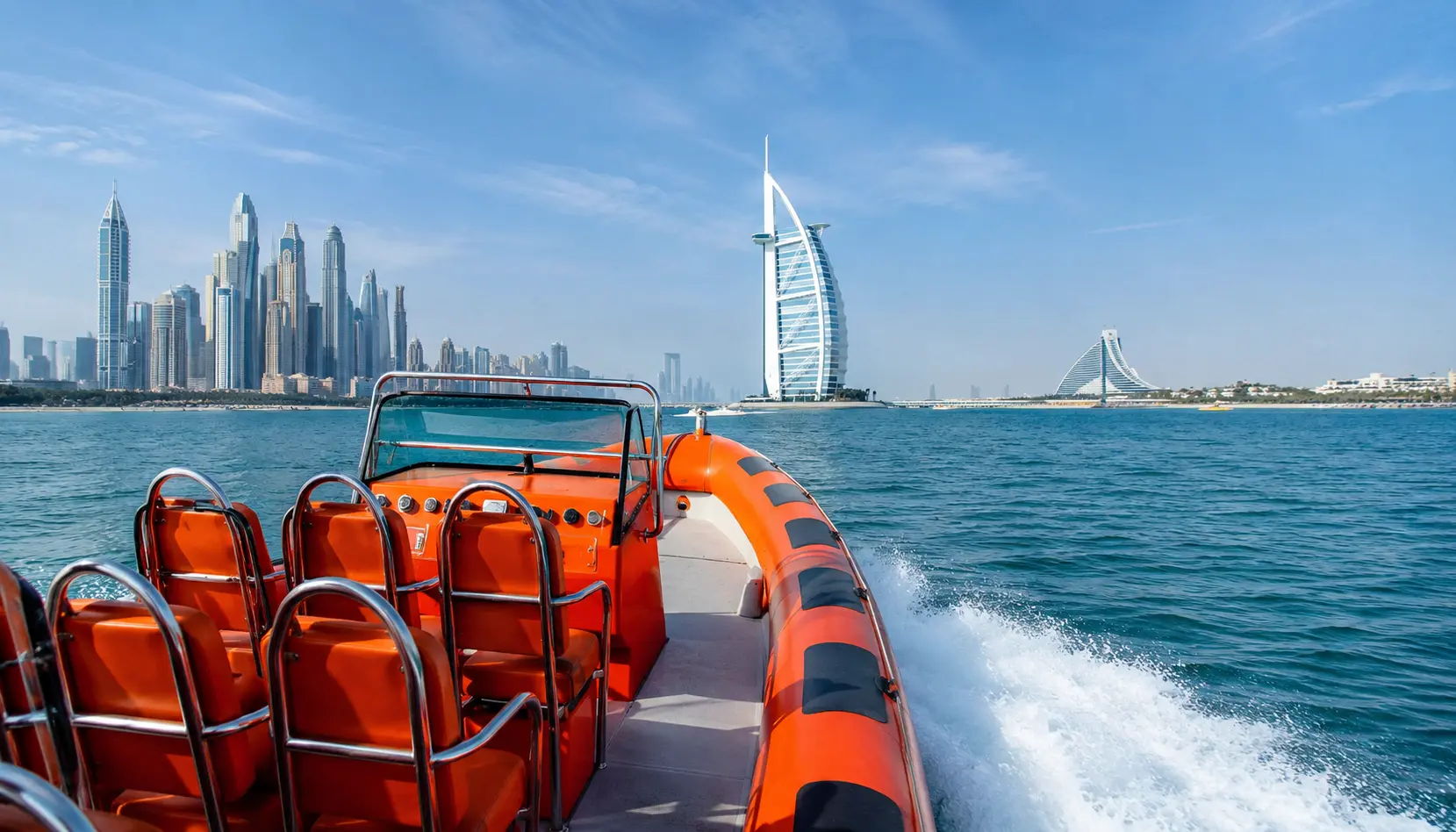 Orange speedboat on Dubai waters with Burj Al Arab and skyline in the background, no visible faces