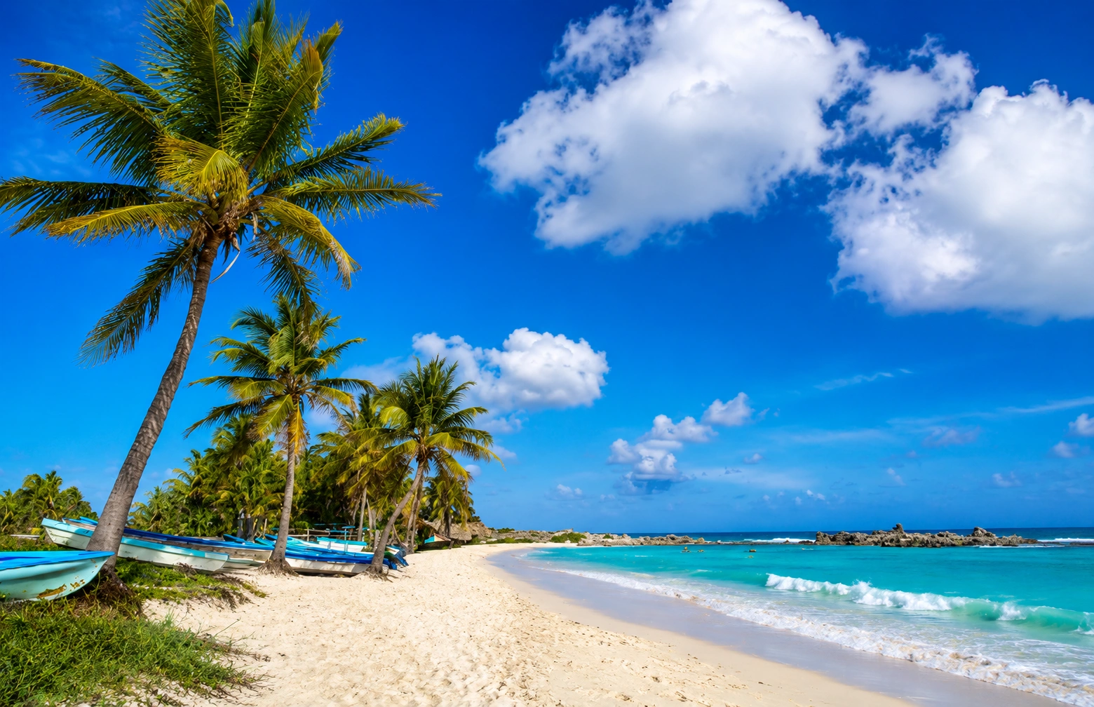 Best Things to Do in Cozumel include relaxing on a white sand beach with turquoise Caribbean waters, swaying palm trees, and a peaceful tropical coastline.