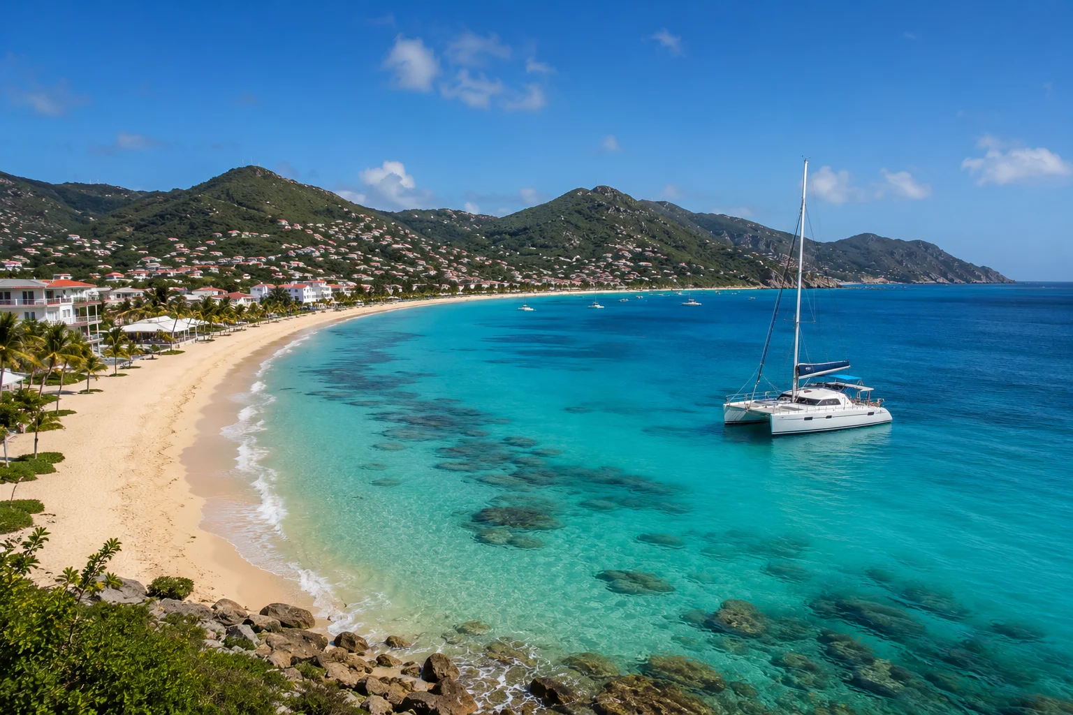 Things to Do in St. Maarten featuring a tropical beach, turquoise waters, and a sailing catamaran